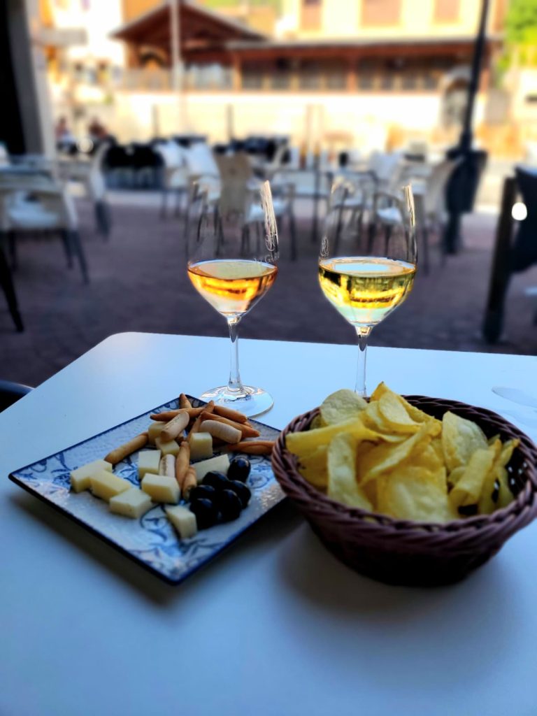 Two glasses of wine at an outdoor table